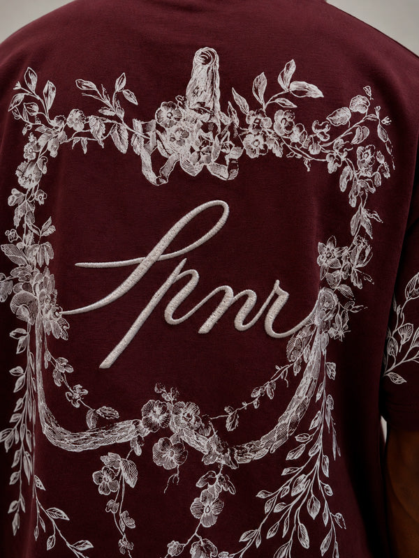 CAMISETA OVERSIZE SPNR FLORES ESPALDA