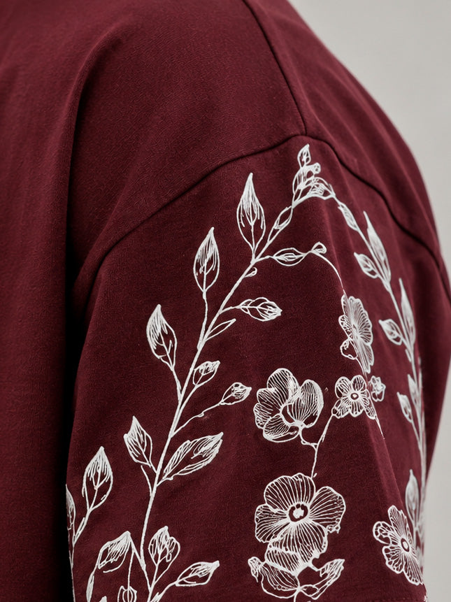 CAMISETA OVERSIZE SPNR FLORES ESPALDA